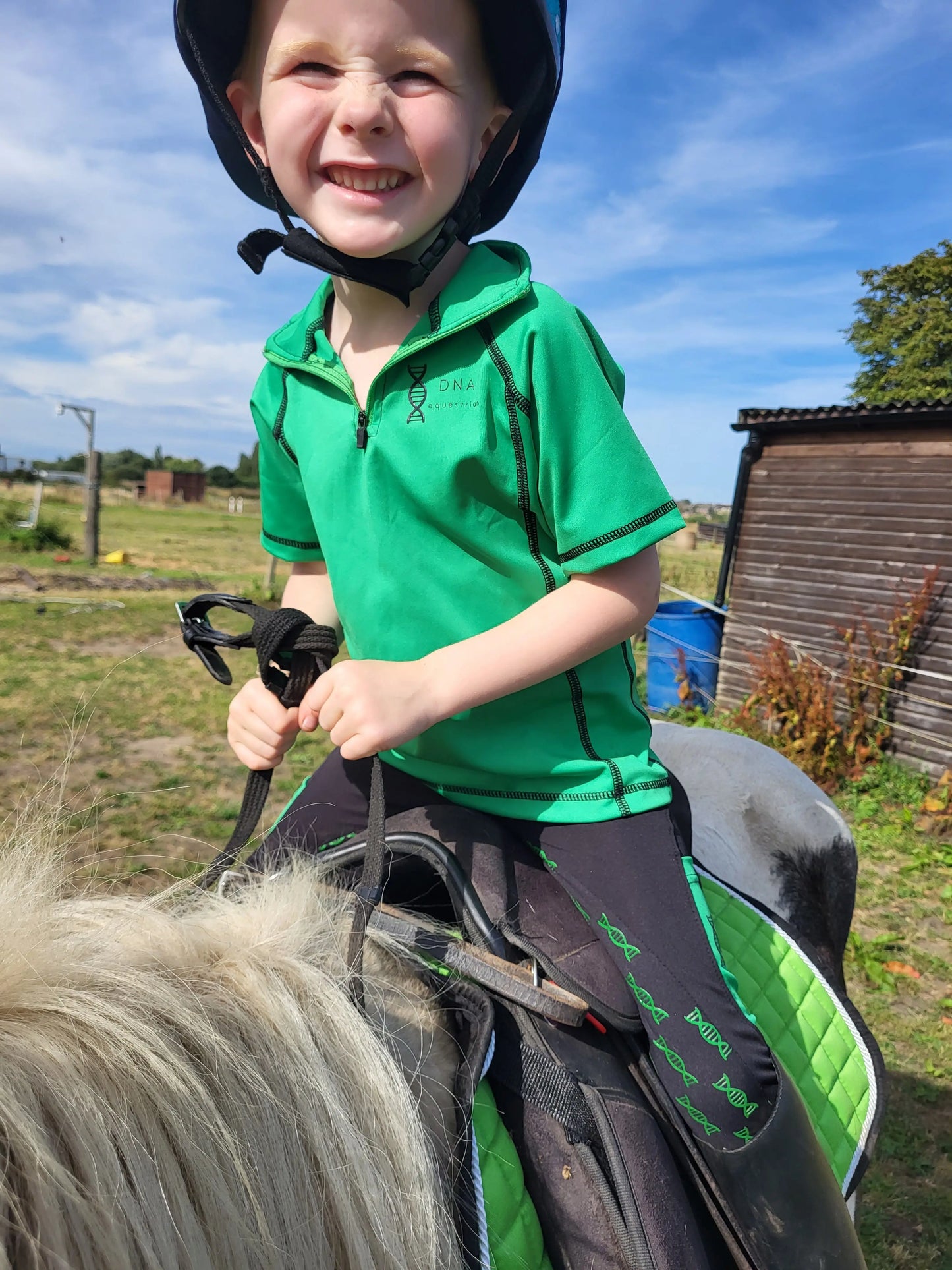 Childrens green shorts sleeved baselayer DNA equestrian ltd
